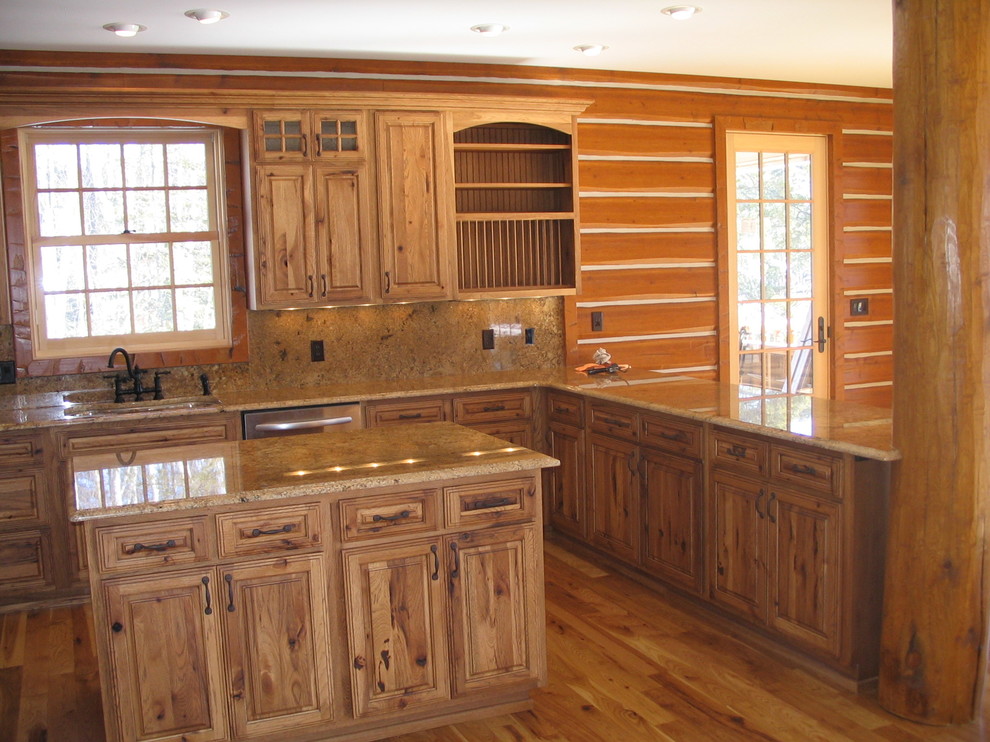 Enclosed kitchen - large rustic u-shaped light wood floor and beige floor enclosed kitchen idea with an undermount sink, raised-panel cabinets, light wood cabinets, quartz countertops, beige backsplash, porcelain backsplash, stainless steel appliances and a peninsula