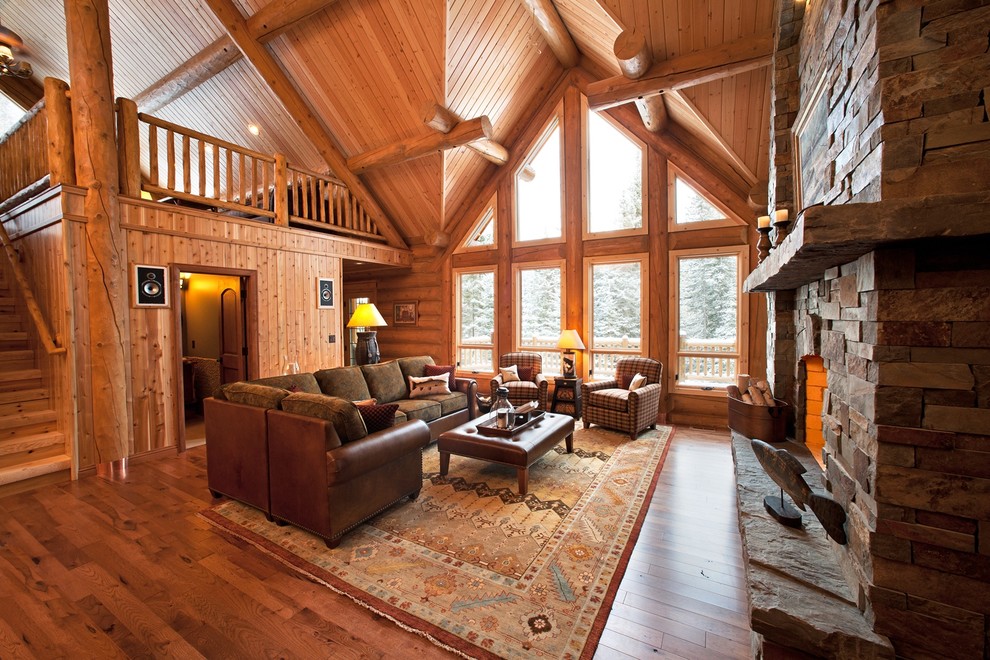 Photo of an expansive country living room in Detroit with a standard fireplace and a stone fireplace surround.