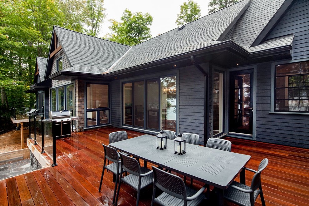 This is an example of a mid-sized traditional backyard deck in Toronto with with dock and no cover.