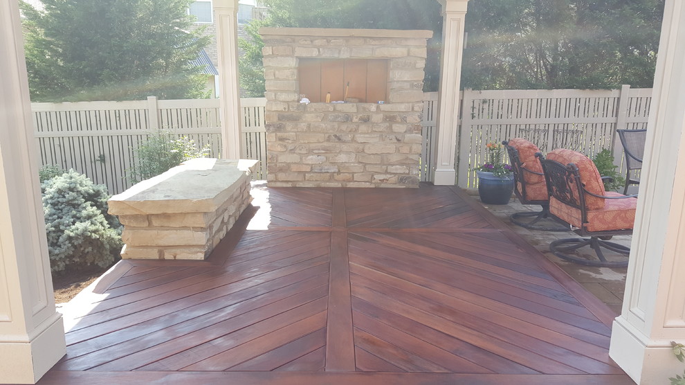 Mid-sized transitional backyard patio photo with a fire pit, decking and a gazebo