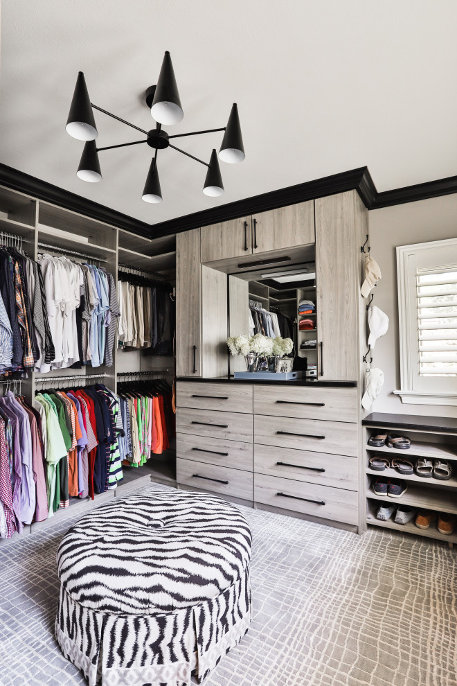 Contemporary men's walk-in wardrobe in St Louis with flat-panel cabinets, grey cabinets, carpet and grey floor.