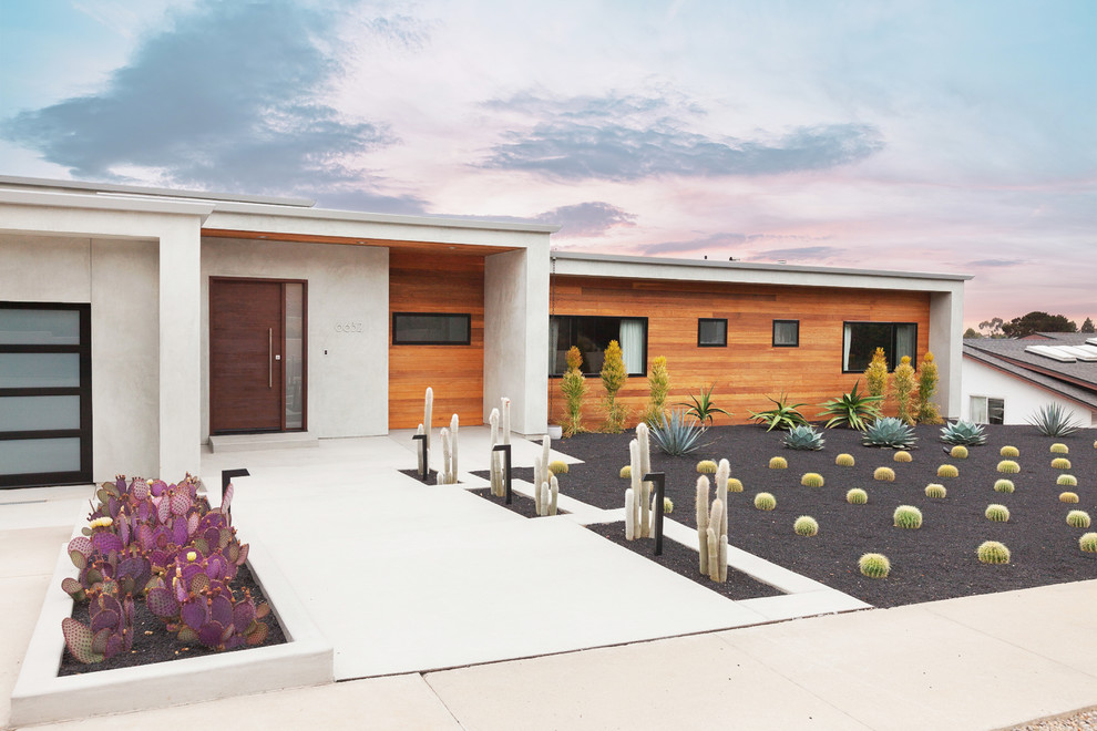 Photo of a contemporary front yard xeriscape in San Diego with a garden path and concrete pavers.