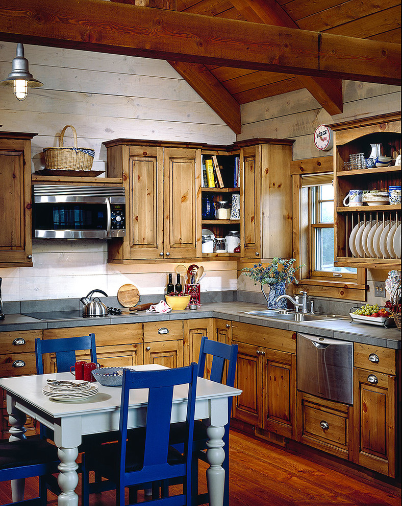 Mid-sized mountain style dark wood floor eat-in kitchen photo with a farmhouse sink, recessed-panel cabinets, medium tone wood cabinets, wood countertops, stainless steel appliances and an island