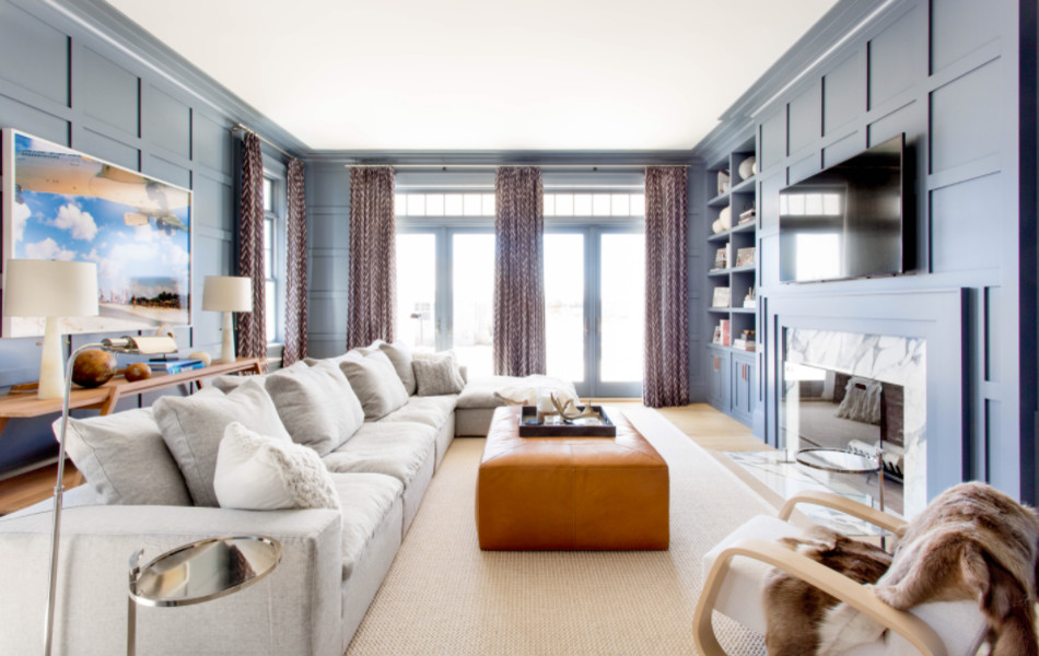 Design ideas for a large contemporary open concept family room in New York with blue walls, light hardwood floors, a standard fireplace, a tile fireplace surround, a wall-mounted tv and beige floor.