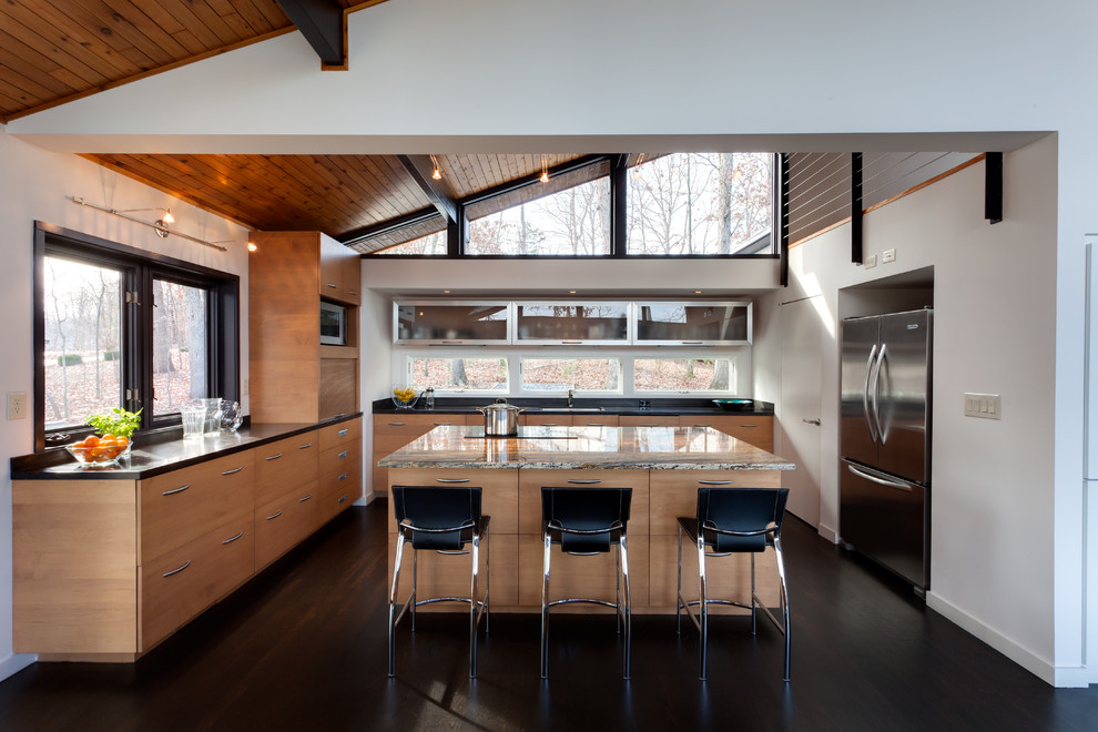 Photo of a large modern u-shaped separate kitchen in Other with a double-bowl sink, light wood cabinets, stainless steel appliances and dark hardwood floors.