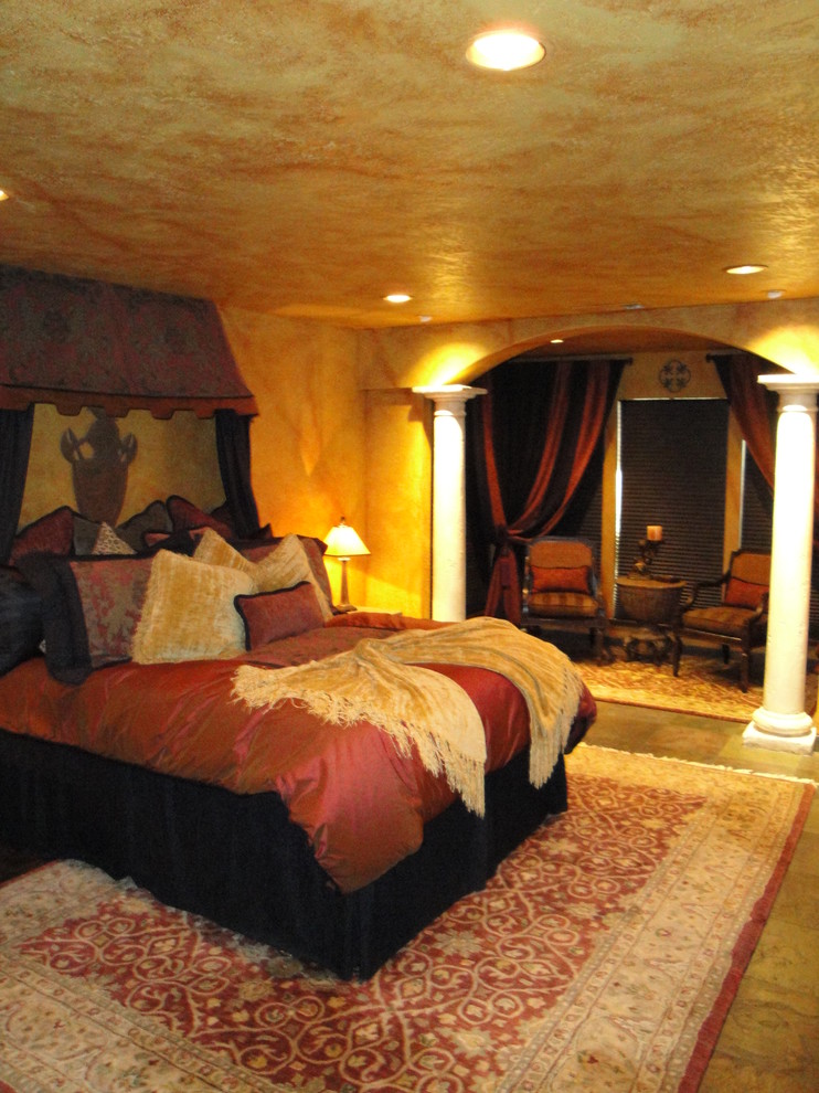 Photo of an eclectic master bedroom in Sacramento with slate floors and beige walls.