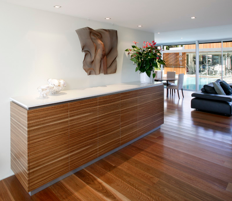Inspiration for a contemporary open concept living room in Sydney with white walls and medium hardwood floors.