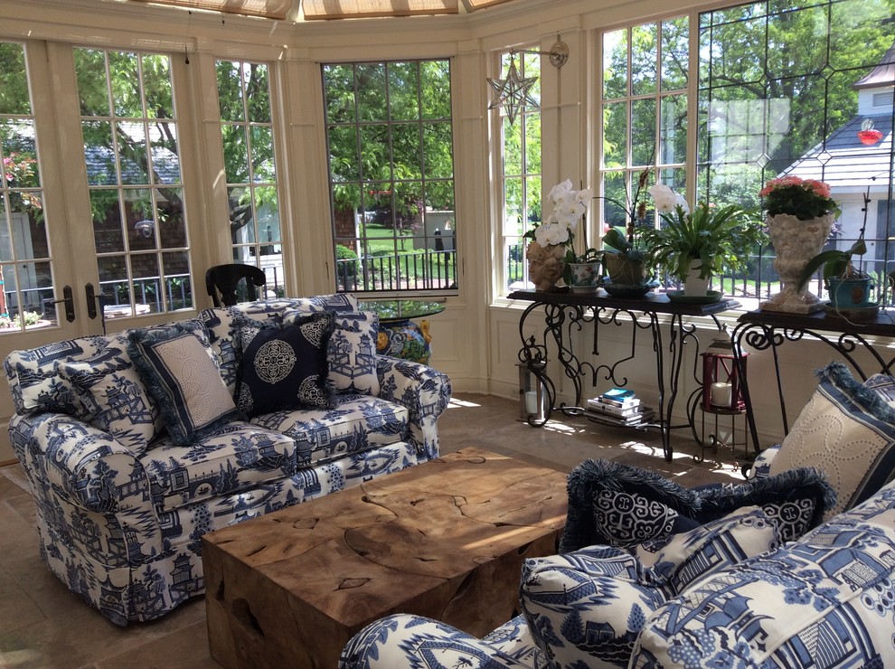 This is an example of a transitional sunroom in Omaha.
