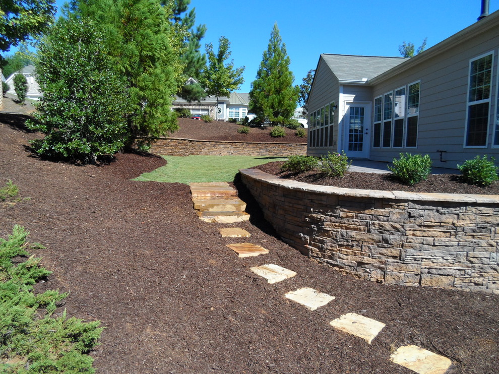 Design ideas for an expansive country backyard full sun garden in Atlanta with concrete pavers.