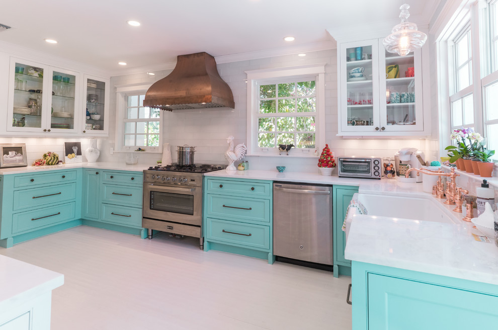This is an example of a tropical kitchen in Other with beaded inset cabinets, turquoise cabinets, marble benchtops, painted wood floors and white floor.