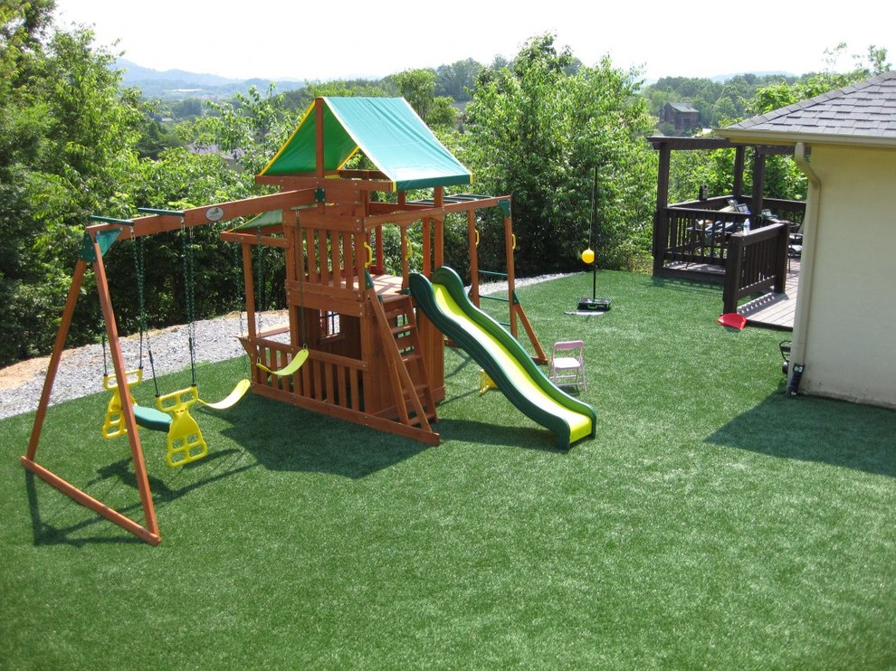 Inspiration for a large traditional backyard full sun garden for spring in Phoenix with with outdoor playset.
