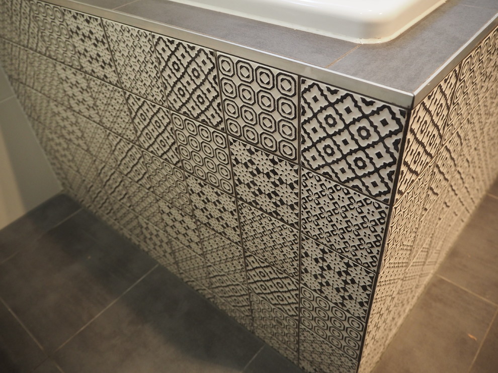 Inspiration for a small contemporary master bathroom in Sydney with flat-panel cabinets, white cabinets, a one-piece toilet, white tile, porcelain tile, white walls, porcelain floors, a vessel sink, wood benchtops, brown floor, a hinged shower door, brown benchtops, a niche, a double vanity, a floating vanity, a drop-in tub and an alcove shower.