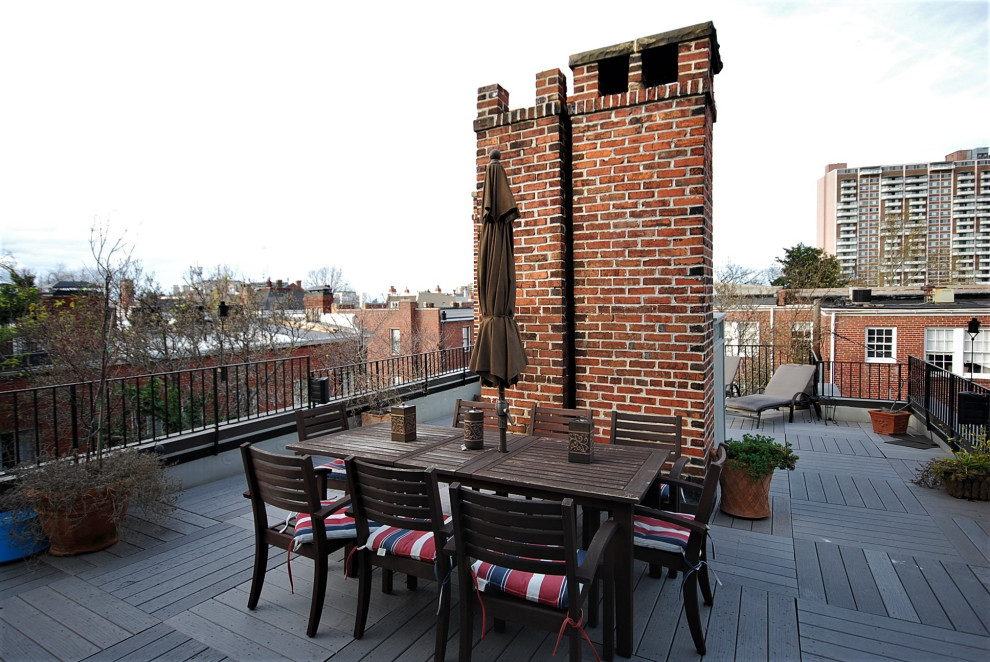 Inspiration for a mid-sized industrial rooftop and rooftop deck in DC Metro with with privacy feature, no cover and metal railing.