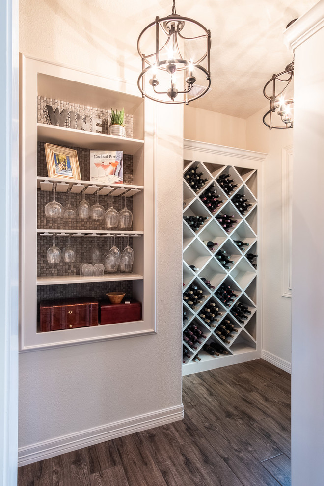 Inspiration for a mid-sized wine cellar in Houston with porcelain floors, display racks and brown floor.