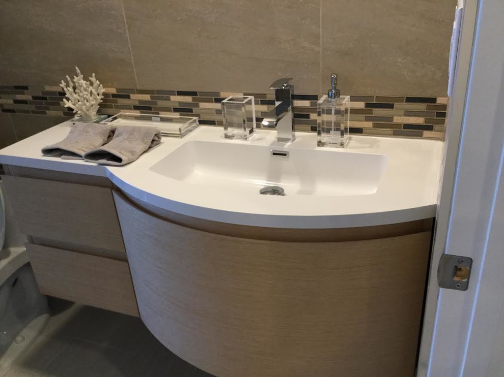 Photo of a mid-sized transitional 3/4 bathroom in New York with flat-panel cabinets, light wood cabinets, beige tile, brown tile, porcelain tile, beige walls, ceramic floors, solid surface benchtops and white floor.