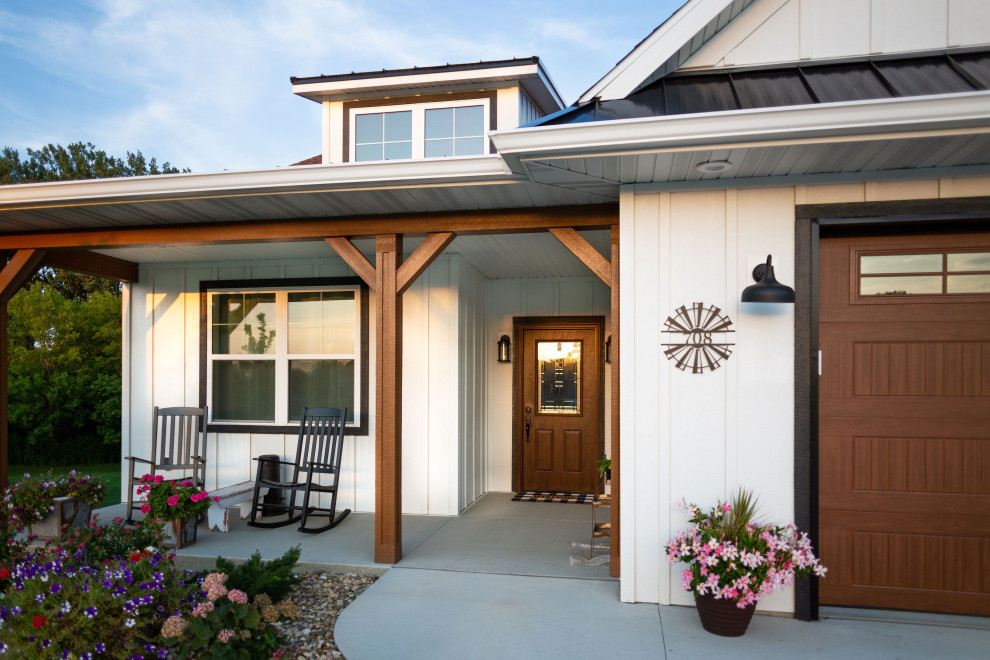 Inspiration for a mid-sized country one-storey white house exterior in Cedar Rapids with mixed siding, a gable roof, a shingle roof, a brown roof and board and batten siding.