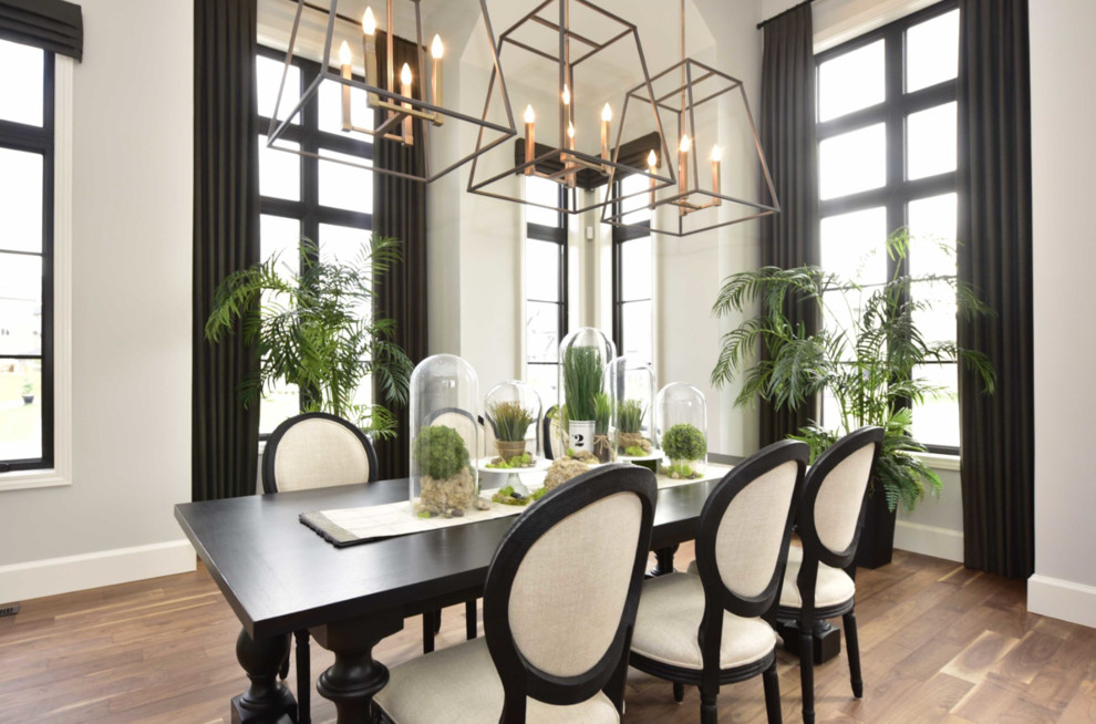 Kitchen/dining room combo - large transitional medium tone wood floor and brown floor kitchen/dining room combo idea with gray walls and no fireplace