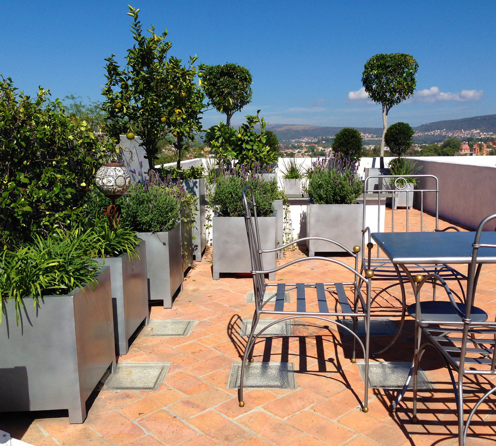 This is an example of a mediterranean rooftop and rooftop deck in Other.