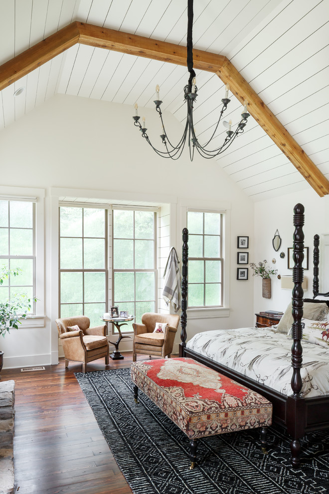 Inspiration for a traditional master bedroom in Louisville with white walls and dark hardwood floors.