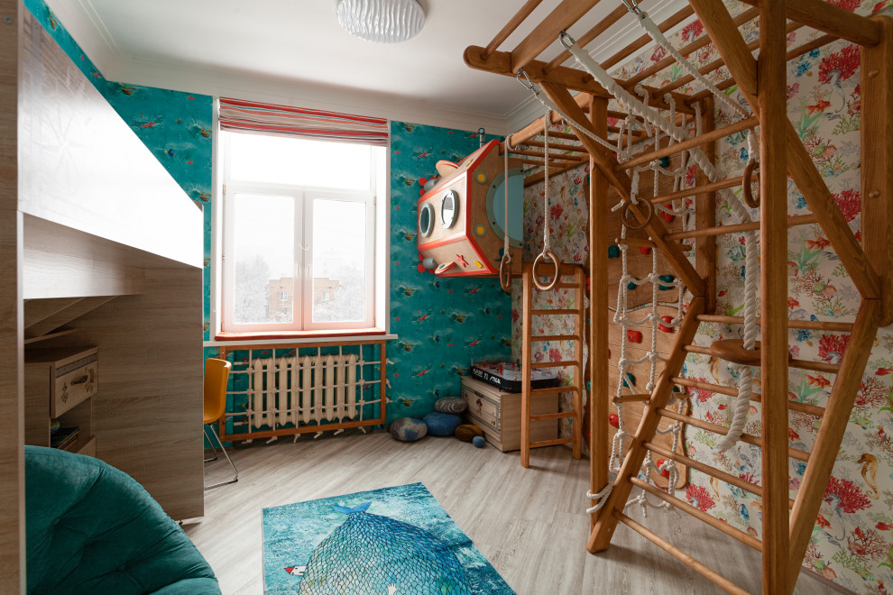 This is an example of an eclectic kids' room in Moscow with multi-coloured walls and grey floor.