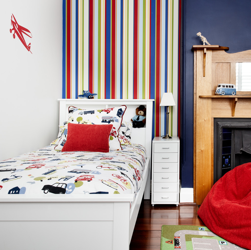 Inspiration for a transitional kids' bedroom for kids 4-10 years old and boys in Melbourne with multi-coloured walls and dark hardwood floors.
