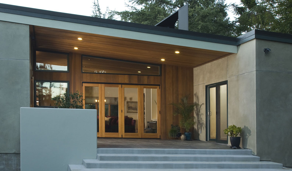 Design ideas for a contemporary patio in San Francisco with a roof extension.