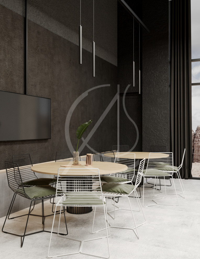 Large modern open plan dining in London with black walls, concrete floors and grey floor.