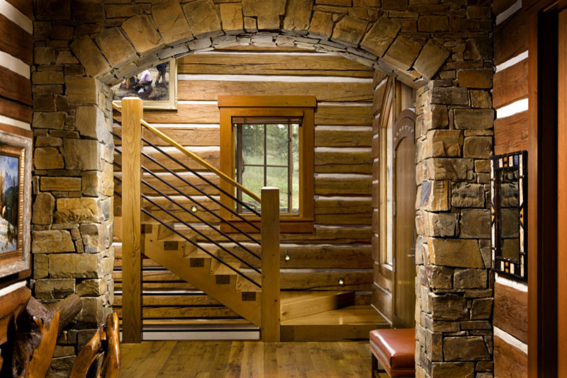 Mountain style medium tone wood floor front door photo with a medium wood front door