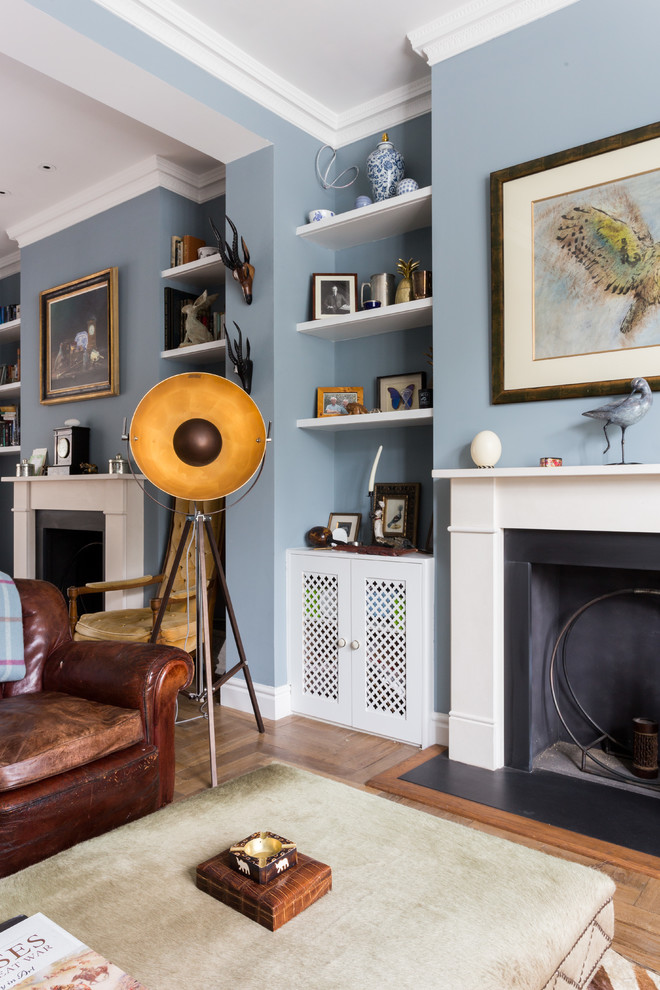 This is an example of an eclectic family room in London.