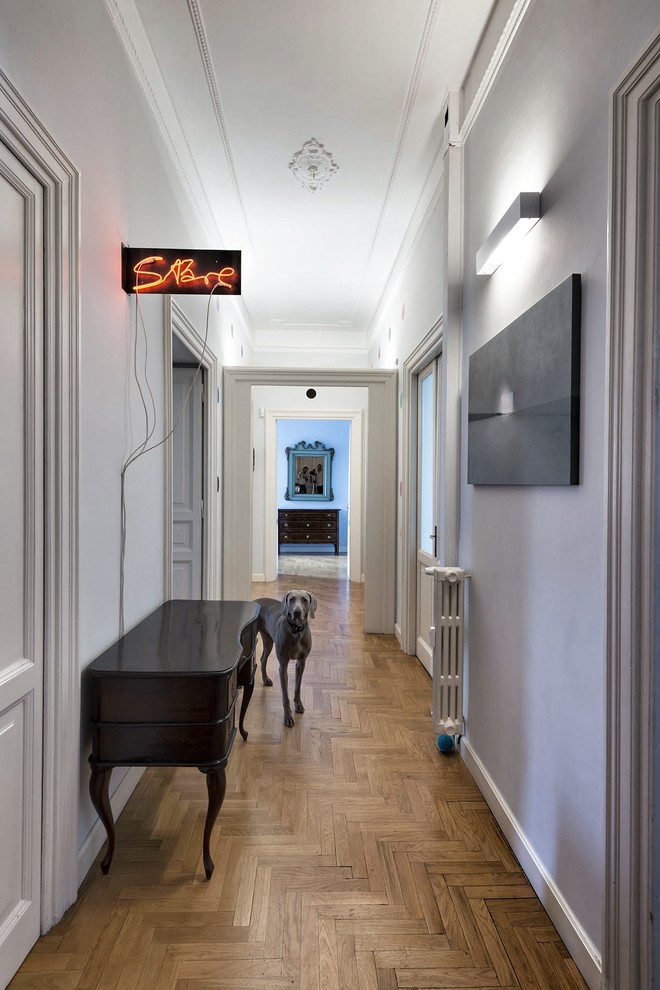 Design ideas for a large eclectic hallway in Other with grey walls.