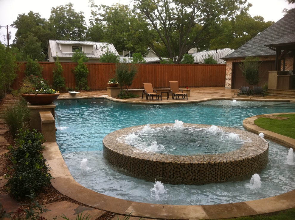 Design ideas for a large contemporary backyard custom-shaped pool in Dallas with a hot tub and concrete pavers.