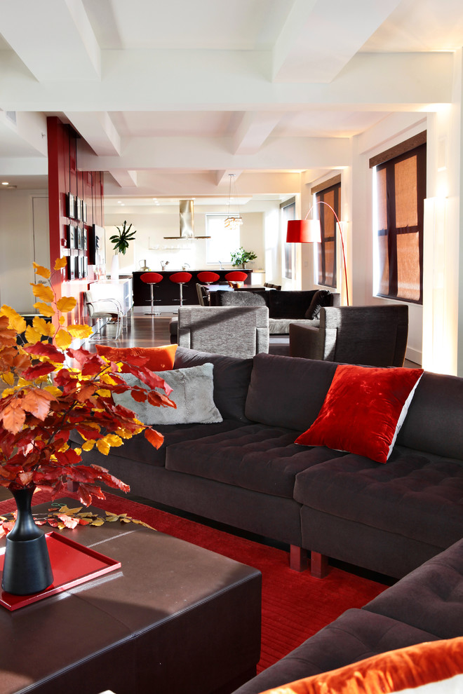 Design ideas for a modern open concept living room in New York with red floor.