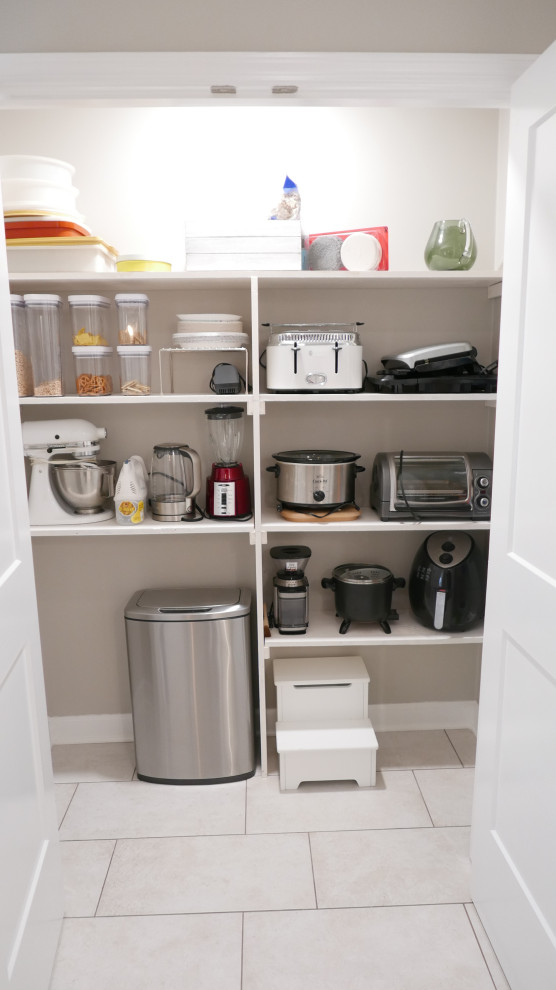 Eat-in kitchen - mid-sized transitional galley porcelain tile and beige floor eat-in kitchen idea with an undermount sink, shaker cabinets, white cabinets, quartz countertops, brown backsplash, porcelain backsplash, stainless steel appliances, no island and white countertops