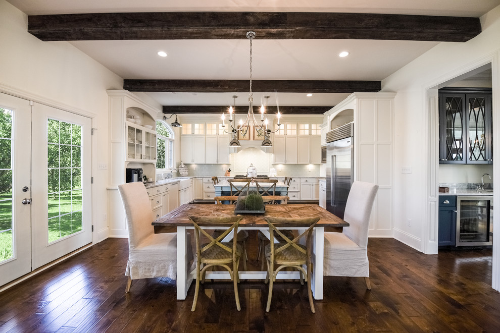 Design ideas for a traditional open plan dining in Louisville with white walls, dark hardwood floors and brown floor.