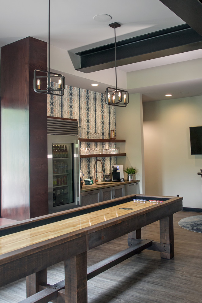 Design ideas for a large transitional single-wall home bar in Milwaukee with an undermount sink, open cabinets, grey cabinets, quartz benchtops, blue splashback, ceramic splashback, grey floor and vinyl floors.