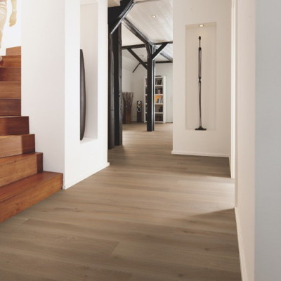Inspiration for a mid-sized contemporary hallway in San Francisco with white walls and light hardwood floors.