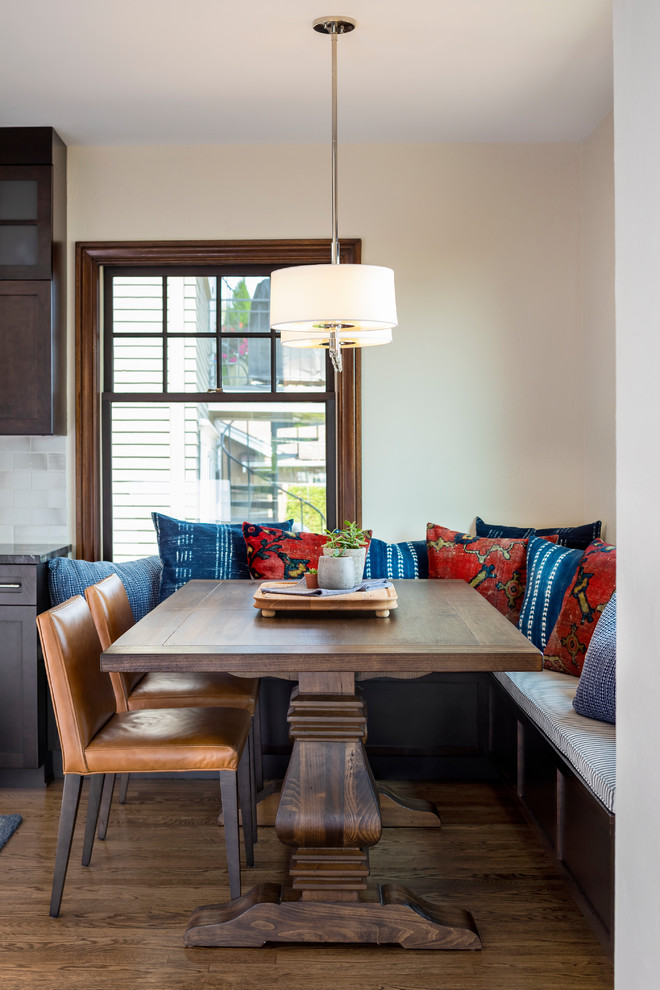 Inspiration for a mid-sized arts and crafts open plan dining in Seattle with dark hardwood floors and brown floor.