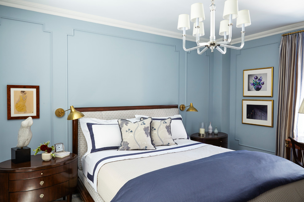 This is an example of a mid-sized traditional master bedroom in New York with blue walls.