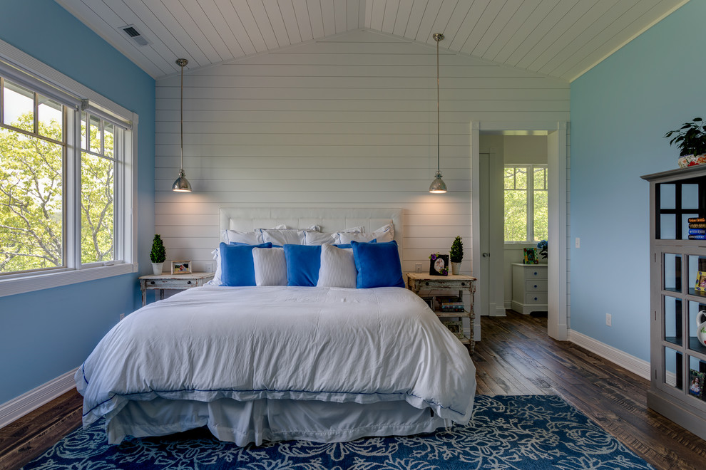 Photo of a transitional master bedroom in Other with multi-coloured walls, dark hardwood floors and brown floor.