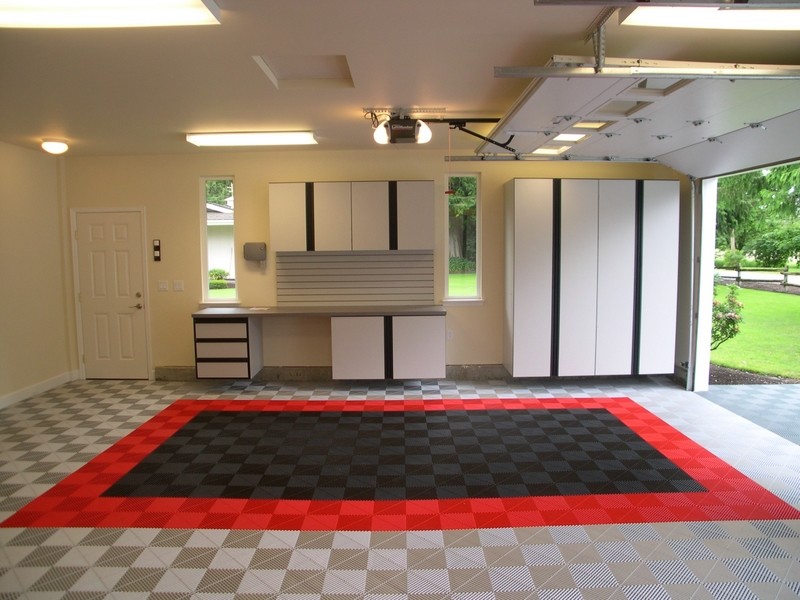 Inspiration for a large modern attached two-car garage remodel in Orange County