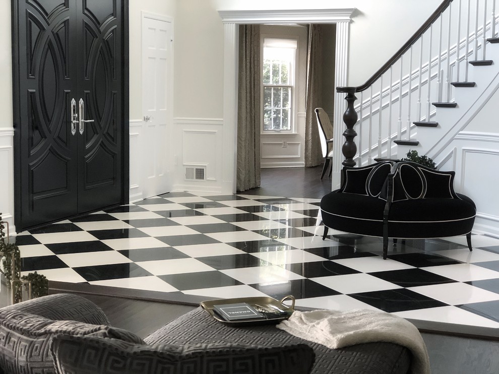 Inspiration for a large transitional foyer in Other with white walls, marble floors, a double front door, a black front door and black floor.