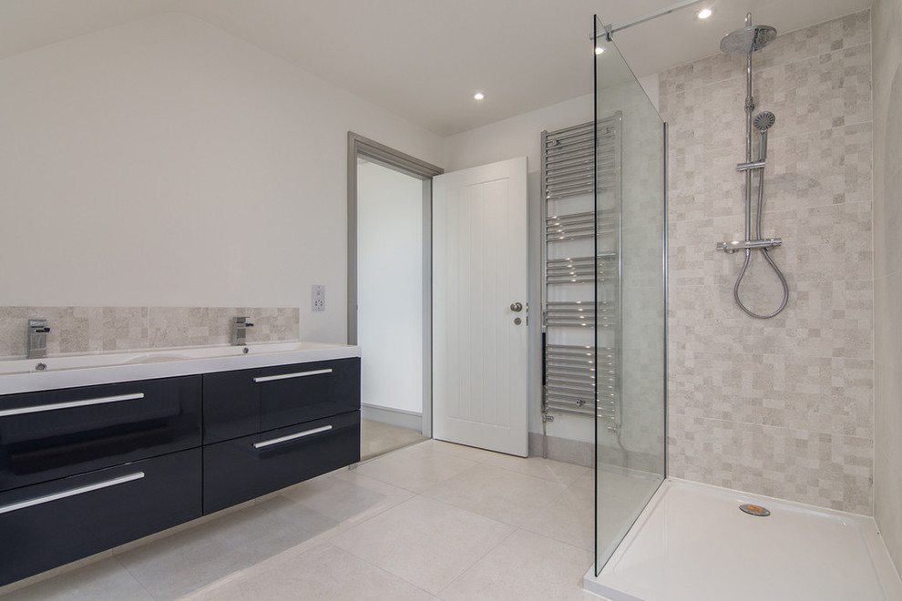 Photo of a mid-sized contemporary master bathroom in Other with black cabinets, a double shower, a one-piece toilet, beige tile, ceramic tile, beige walls, ceramic floors and a wall-mount sink.