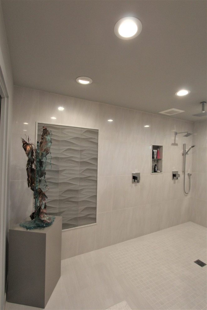 This is an example of a large transitional master bathroom in San Francisco with recessed-panel cabinets, grey cabinets, a curbless shower, gray tile, porcelain tile, grey walls, porcelain floors, an undermount sink, quartzite benchtops, grey floor, an open shower, beige benchtops, a niche, a double vanity and a floating vanity.