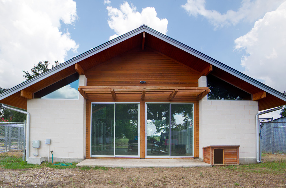Photo of a modern exterior in Austin with wood siding.
