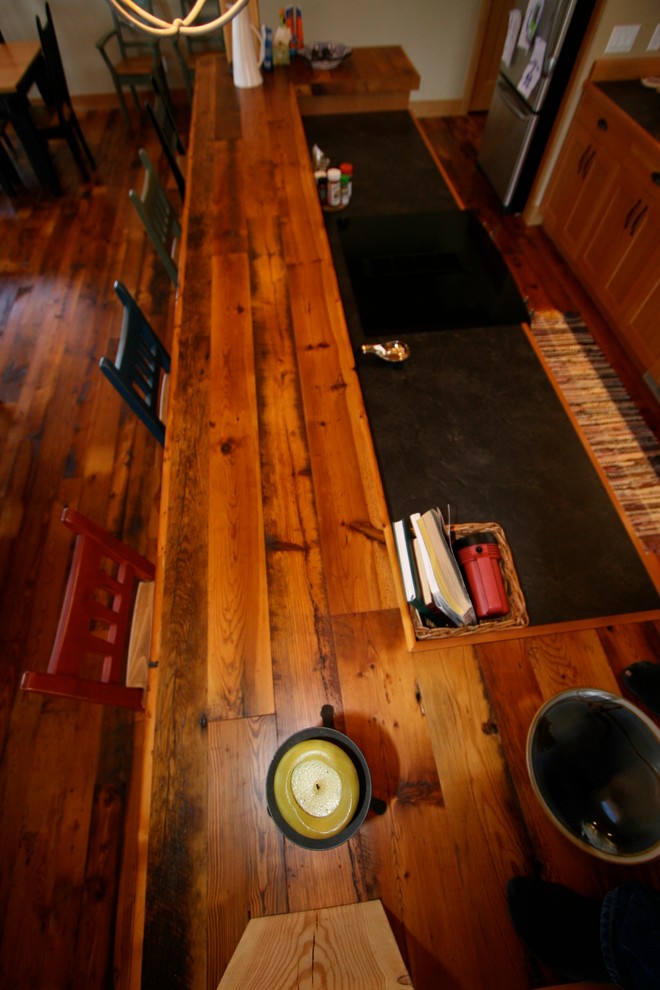 Small mountain style galley dark wood floor open concept kitchen photo in Vancouver with a double-bowl sink, medium tone wood cabinets, wood countertops and a peninsula
