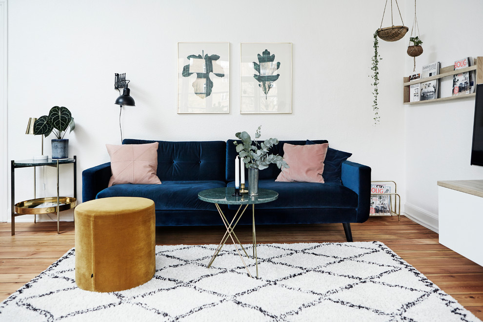 Inspiration for a mid-sized scandinavian living room in Wiltshire with white walls.