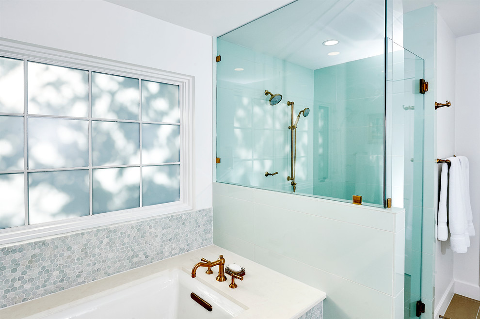 Inspiration for a mid-sized transitional master bathroom in Austin with beaded inset cabinets, white cabinets, an undermount tub, an alcove shower, a one-piece toilet, green tile, limestone floors, an undermount sink and limestone benchtops.