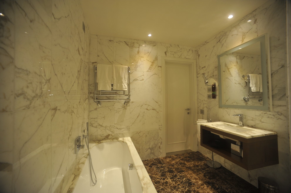 Design ideas for a mid-sized modern 3/4 bathroom in Florence with open cabinets, dark wood cabinets, an undermount tub, a corner shower, a wall-mount toilet, white tile, marble, white walls, marble floors, an undermount sink and marble benchtops.