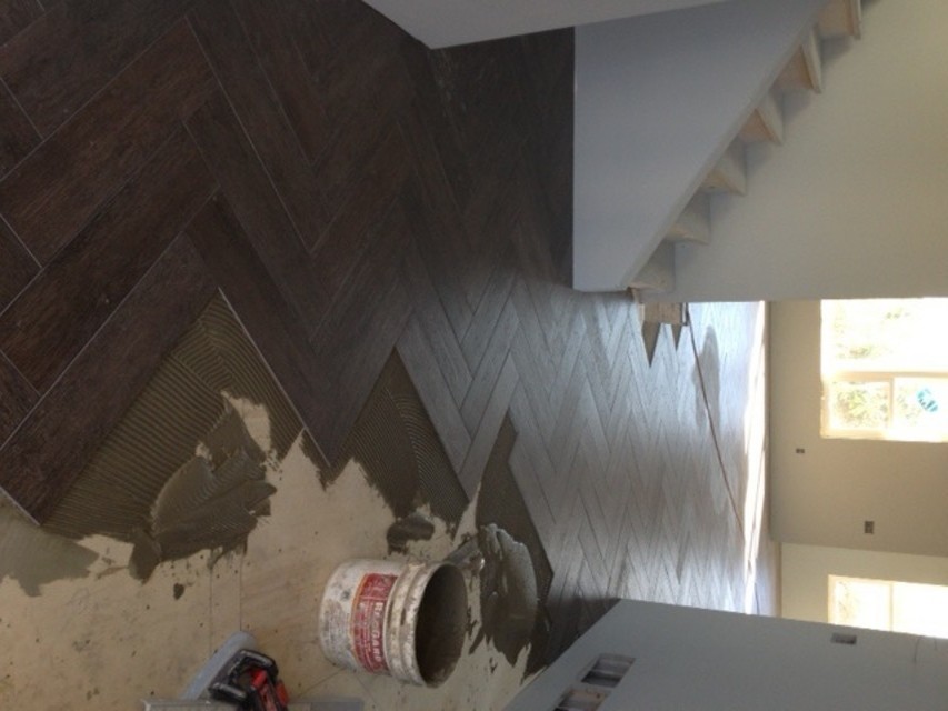 What direction should herringbone pattern point?