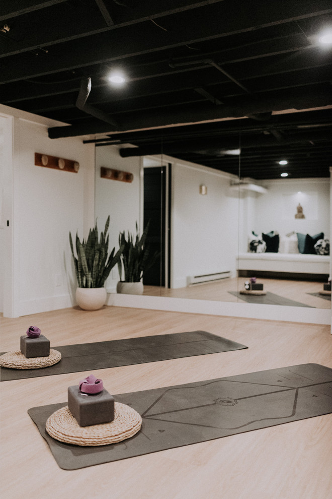 This is an example of a transitional home yoga studio in Cleveland.